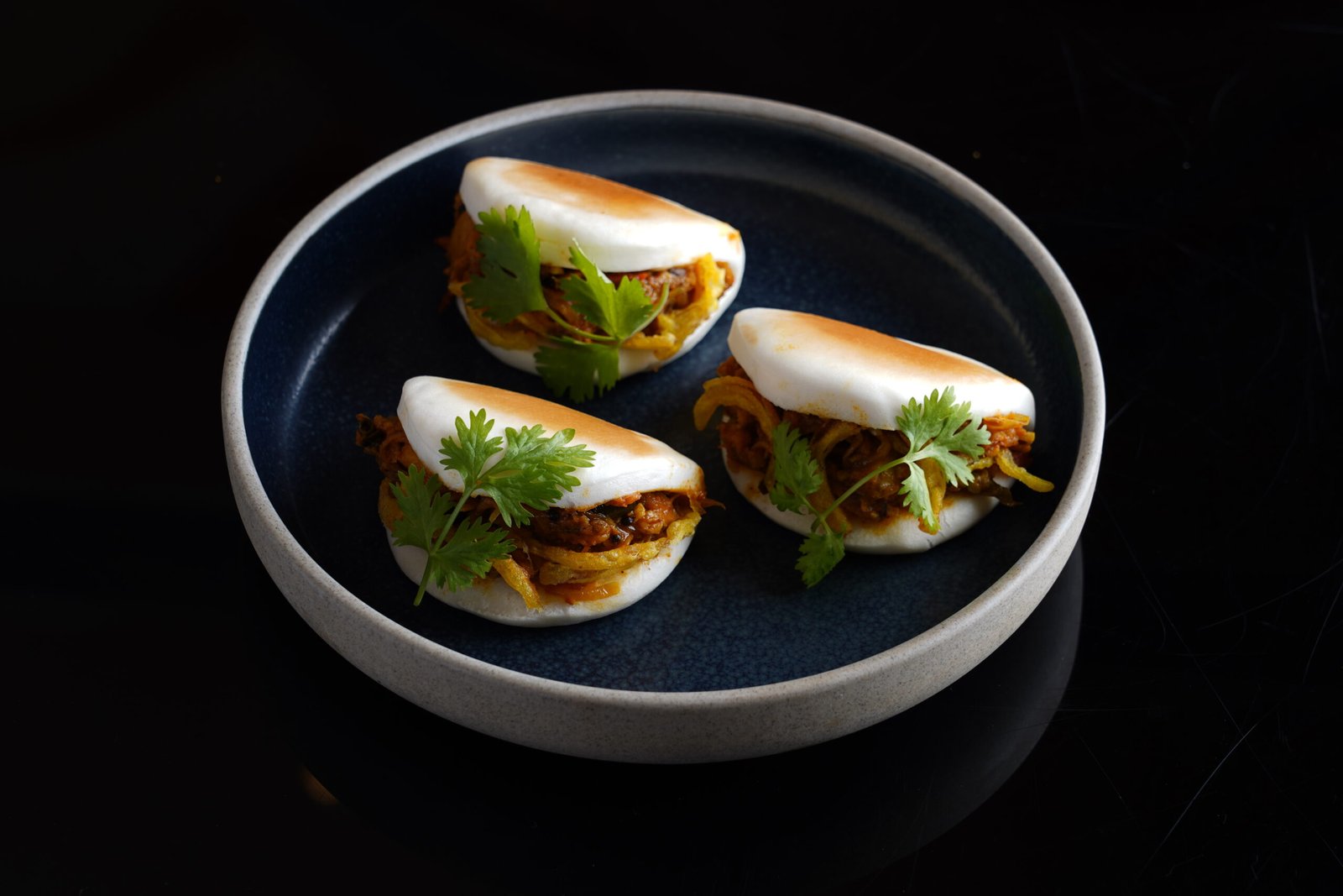 Steamed Bao- Chicken Ularthiyathu & Raw Mango Chutney